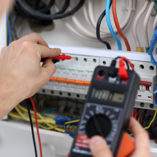 An Expert Electrician Performing an EICR Test